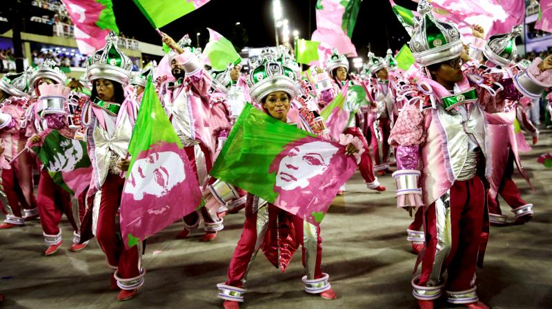 Performers hold flags with an image of slain councilwoman Marielle Franco during the perform of the Mangueira samba school at the Carnival celebrations in Rio de Janeiro on Tuesday. (Photo: AP)