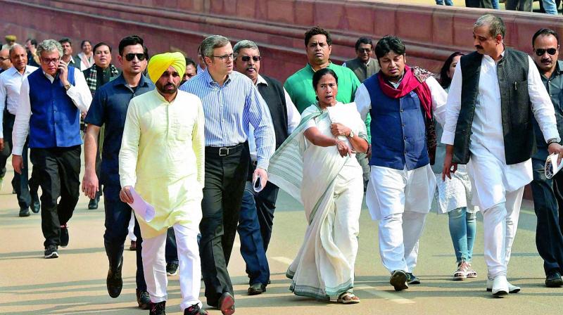 TMC supremo and WB CM Mamata Banerjee, National Conference leader Omar Abdullah, AAP MP Bhagwant Mann and MPs at a protest in New Delhi on Wednesday. (Photo: PTI)