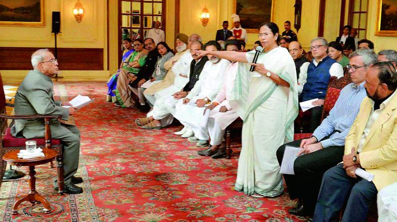 West Bengal Chief Minister Mamata Banerjee speaks as a delegation of MPs led by her met President Pranab Mukherjee over the demonetisation issue, at Rashtrapati Bhavan in New Delhi on Wednesday. (Photo: PTI)