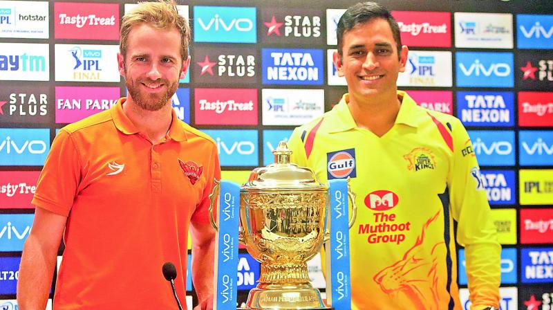 SRH captain Kane Williamson and his CSK counterpart M.S. Dhoni pose with the IPL trophy on Saturday. (Photo: AP)