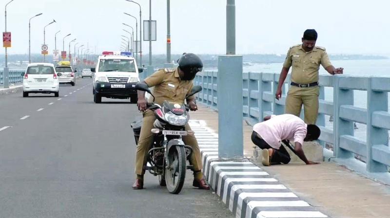 Ramnad policemen check Pamban bridge on Saturday (Photo: DC)