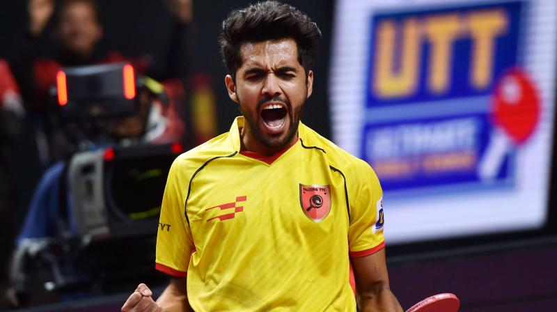 SanilShetty of Falcons TTC reacts during the mens singles match action against Aruna Quadri of Yoddhas at the Ultimate Table Tennis League at Nehru Indoor Stadium. (Photo: PTI)