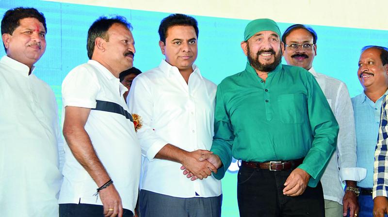 TRS leader and caretaker minister K.T. Rama Rao greets actor Vijay Chander during Seemandrula Sangibhavam Sabha organised at Kukatpally on Saturday. 	 P. Pawan