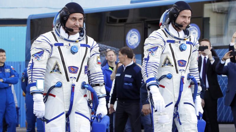 US astronaut Nick Hague, right and Russian cosmonaut Alexey Ovchinin, member of the main crew of the expedition to the International Space Station (ISS), walk prior the launch of Soyuz MS-10 space ship at the Russian leased Baikonur cosmodrome, Kazakhstan, Thursday, Oct. 11, 2018. (AP Photo/Dmitri Lovetsky, Pool)
