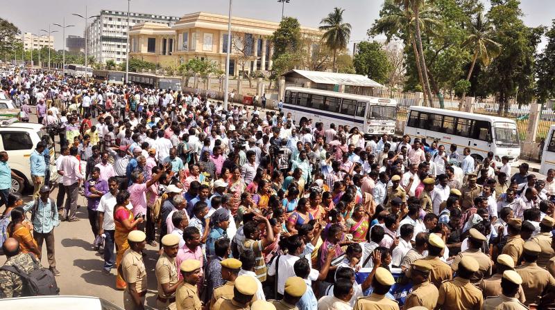 Members of Jactto-Geo stage protest and road roko pressing for demands on Walajah road, on Tuesday.	(Photo: DC)