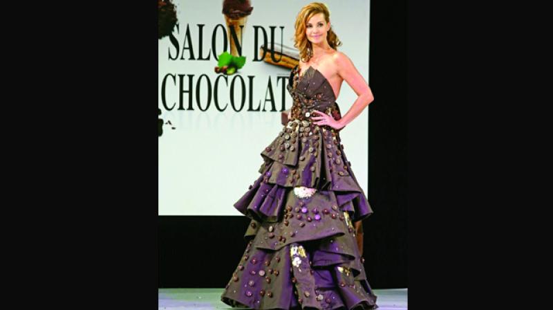 Actress Ingrid Chauvin wearing a Princess dress made of chocolate.