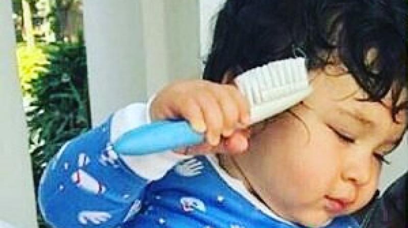 Taimur Ali Khan captured combing his hair. (Photo: Instagram)