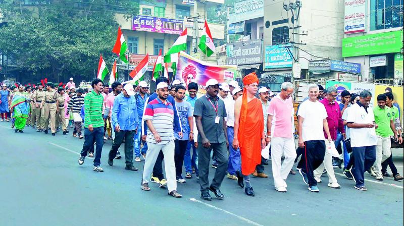 Students and staff of (VVIT) take part in the Dargah to Durga 33-kilometre National Integration walk at Guntur city on Friday. (Photo: DC)