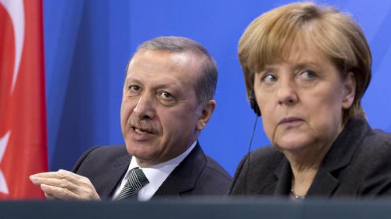 German Chancellor Angela Merkel with Turlish President Recep Tayyip Erdogan during a joint news conference in 2014. (Photo: AP)