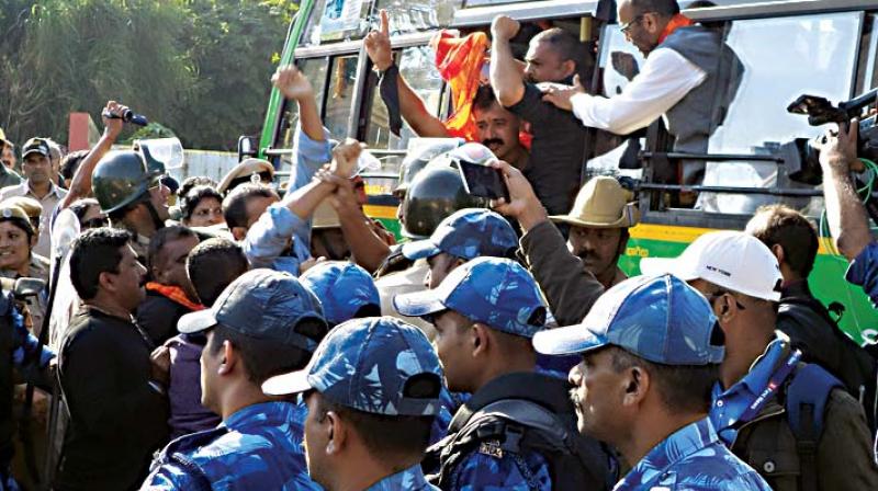 Police taking away Hindu activists who were protesting against  celebration of Tipu Jayanti in Madikeri on Saturday (Photo: KPN)