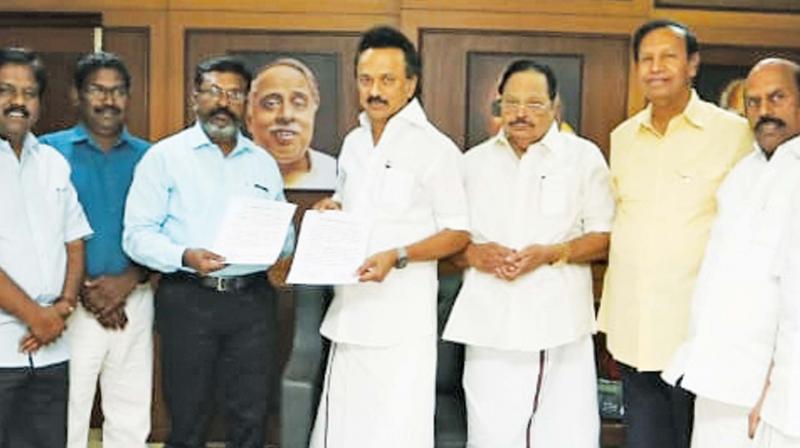 DMK president M.K Stalin and VCK Party leader Thol. Thirumavalavan exchange agreement for an alliance for the upcoming Lok Sabha polls at Anna Arivalayam. (Photo: DC)
