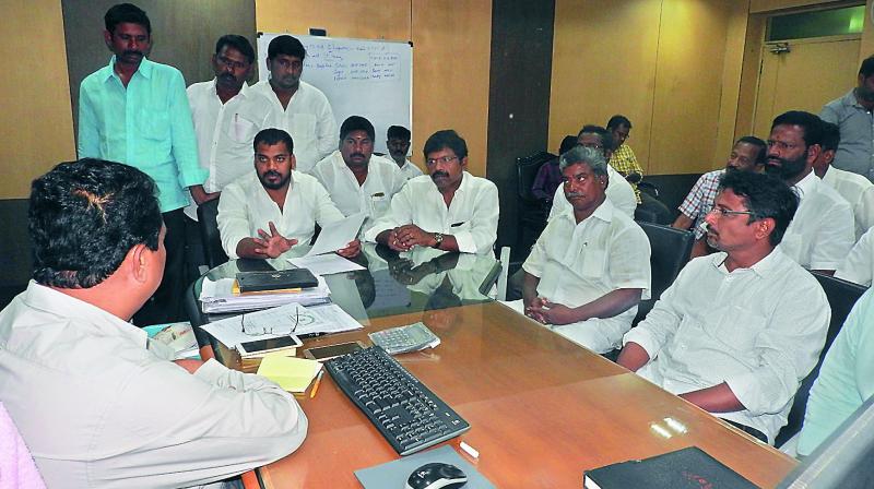 Nellore City legislator Dr P. Anilkumar Yadav talks about water contamination in several wards of the city during a meeting with the Commissioner of Nellore Civic Body SK Alim Basha at Nellore on Thursday. (Photo: DC)