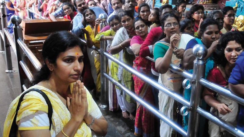Devotees at the Attukal temple on Monday.	(DC)
