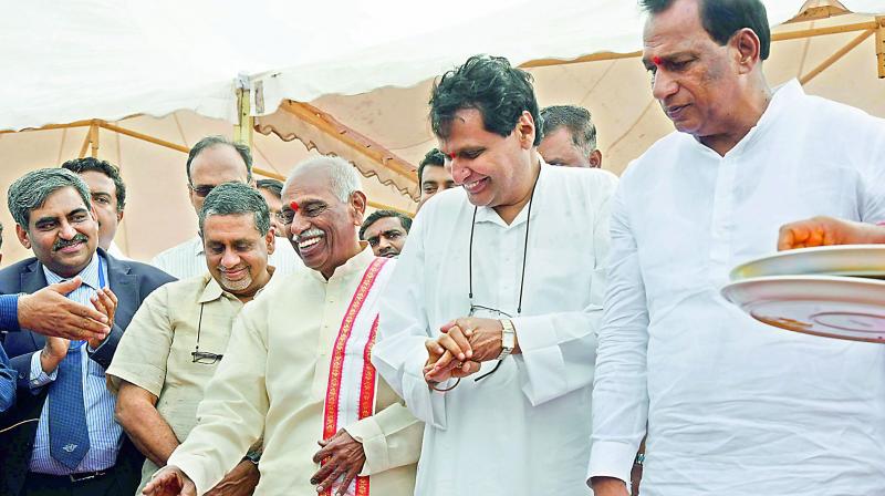Union minister for civil aviation, commerce and industry, Suresh Prabhu, at Begumpet Airport on Thursday. Former Union minister and MP Bandaru Dattatreya and MP Malla Reddy are also seen. 	(Photo: DC)