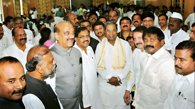 Deputy Chief Minister Dr G. Parameshwar and former CM Siddaramaiah at a meeting of defeated Congress candidates in Assembly polls, in Bengaluru on Monday 	(Photo: KPN)