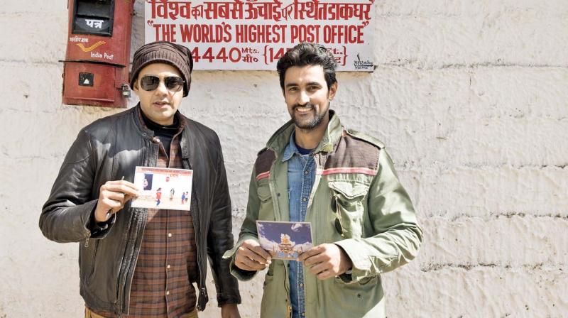 Cyrus and Kunal at the worlds highest post office.