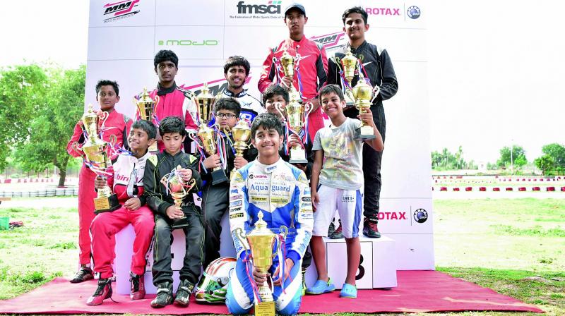 Winners pose with the trophies after emerging champions in Round One of the 14th Meco Motorsports FMSCI National Rotax Max Karting Championship that held at the Chicane Circuit in Hyderabad.