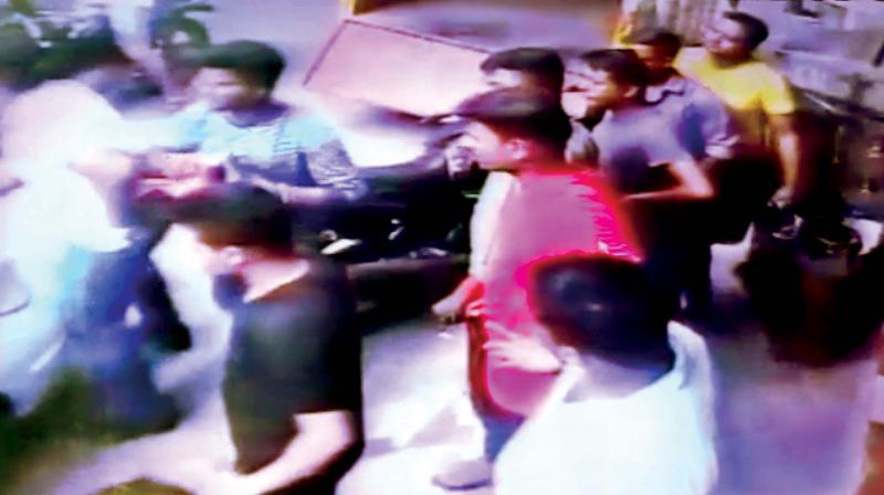 CCTV grab shows two car-lifters (at the far left) trying to flee on seeing Sivaraj (not in the picture) chasing them.  (Photo:DC)