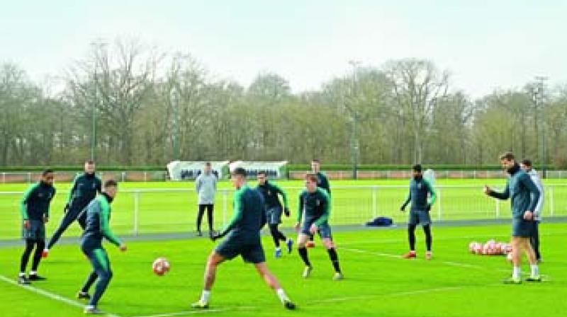 Tottenham Hotspur players at a training session in London on Tuesday, the eve of their Champions League round of 16 first leg match against Dortmund. (Photo: AFP)