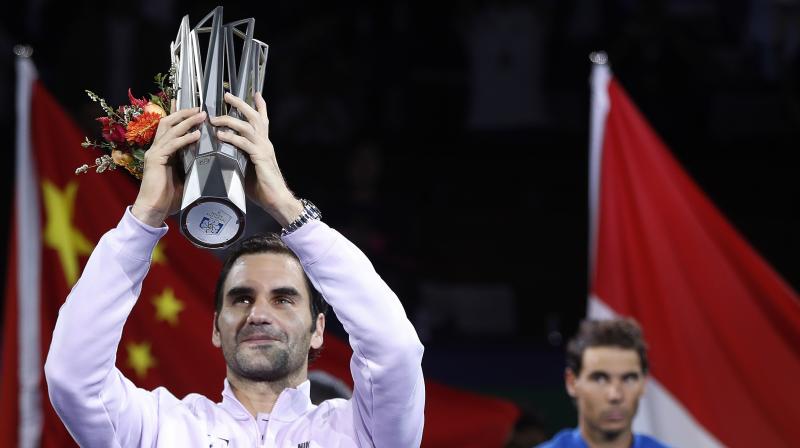 Roger Federer got one over his old rival Rafael Nadal to win the Shanghai Masters 6-4, 6-3. This was a 94th title for the Swiss legend. (Photo: AP)
