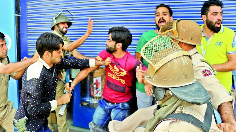 Police arrested dozens of youths during clashes at Lal Chowk triggered by the killing of a top LeT militant and a civilian in Pulwama encounter.  (Photo: H.U. Naqash)