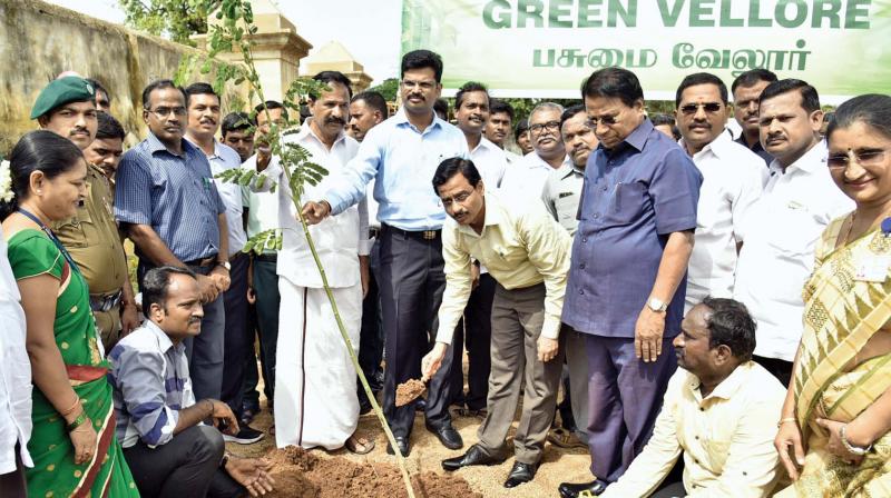 Vellore Collector  S.A. Raman inaugurates VIT Green Vellore mission by planting a tree sapling on Wednesday. VIT Chancellor G.Viswanathan, Vice-President G.V. Selvam are also seen. 	(Photo:DC)