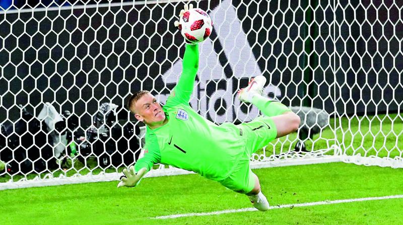 England goalkeeper Jordan Pickford stops a penalty shot from Carlos Bacca of Colombia during their Round of 16 match at the Spartak Stadium in Moscow on Tuesday. (Photo:AP)
