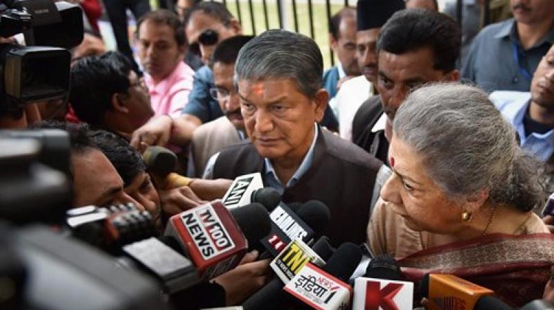 Congress Senior Leader Ambika Soni and Uttrakhand CM Harish Rawat with state Congress party delegation talking to media after meeting the Election Commission of India, in New Delhi on Monday. (Photo: PTI)