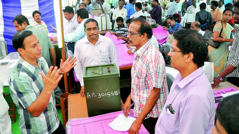 District collector Pravin Kumar inspects the distribution of polling material at Swarna Bharati Indoor Stadium in Visakhapatnam on Wednesday. (Photo: DC)