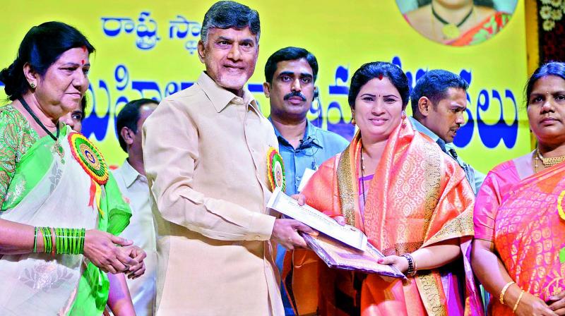 Chief Minister N. Chandrababu Naidu felicitates to Dr T. Vasantha Lakshmi Ravi Kumar from Nellore at Tummalapalli Kalakshetram on the occasion of International Womens Day celebrations in Vijayawada on Wednesday. (Photo: DC)