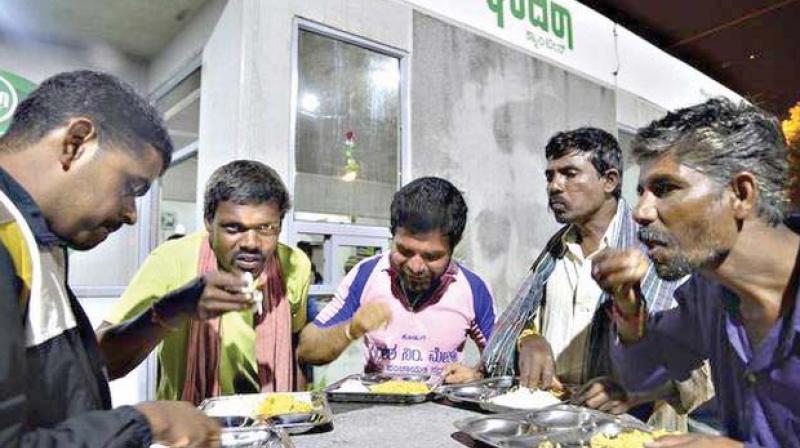People eat at an Indira Canteen in Bengaluru