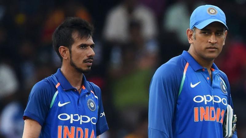 Just like any other youngster, Chahal couldnt control himself when he was about to meet the veteran wicket-keeper batsman. (Photo: AFP)