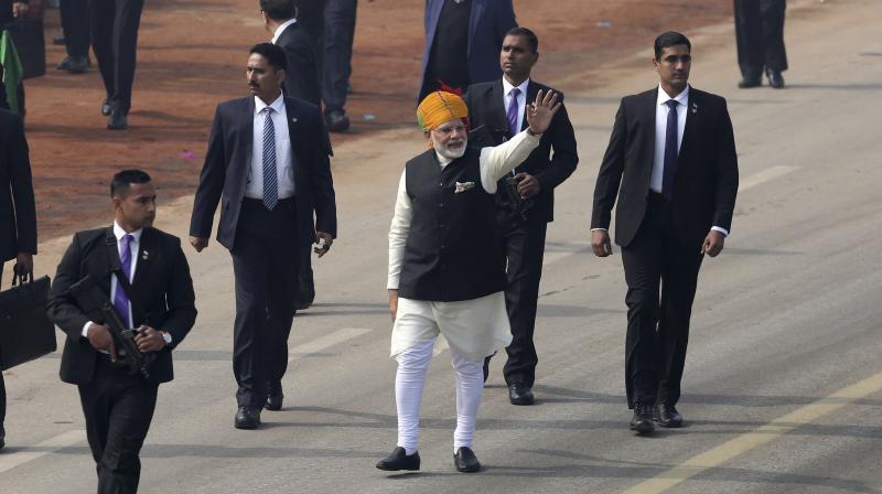 Prime Minister Narendra Modi waves to the crowd during Republic Day parade in New Delhi. (Photo: AP)