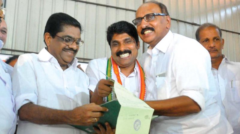 KPCC president V.M. Sudheeran with newly-appointed DCC president T. SIddique and outgoing president K.C. Abu at DCC office in Kozhikode on Wednesday. (Photo: DC)