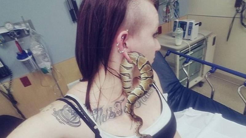 Ashley Glawe, who owns a ball python snake named Bart, had to go to the hospital after she couldnt free herself from her pet. (Photo: Facebook)