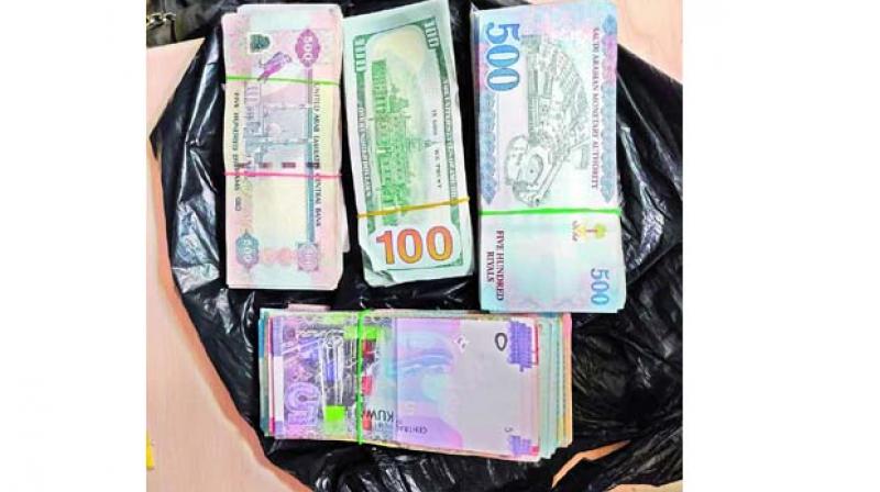 Foreign currency seized by the DRI at Hyderabad Airport on Wednesday.