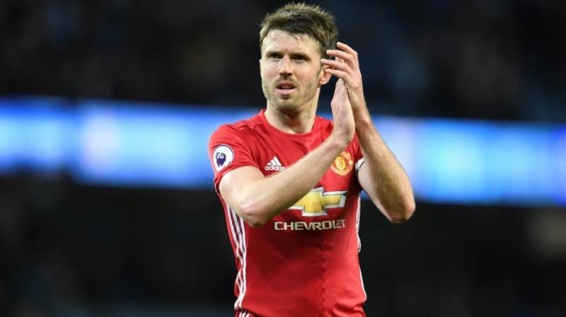 Mourinho believes Carrick, who is back in full training, will return to the pitch over the second half of the season. (Photo: AFP)