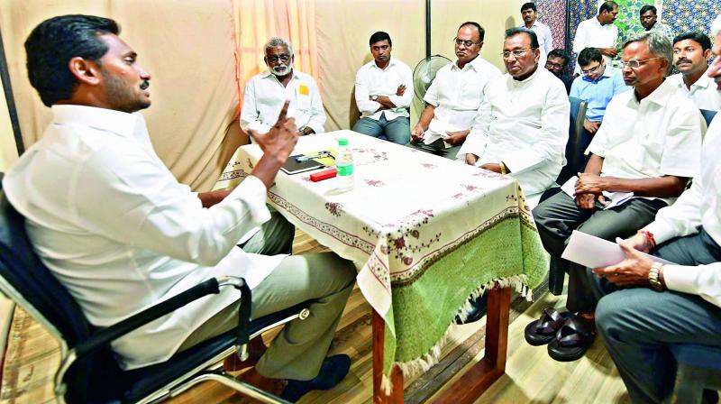 YSRC president Y.S. Jagan Mohan Reddy holds a meeting with the party MPs at Muppala village of Guntur district on Monday. (Photo: DC)