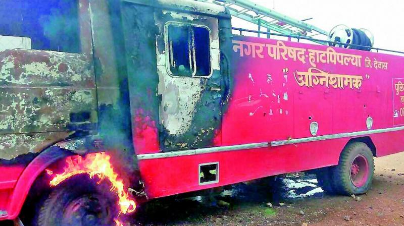 A fire tender that was was torched by the farmers during their agitation in Dewas district on Wednesday. (Photo: PTI)