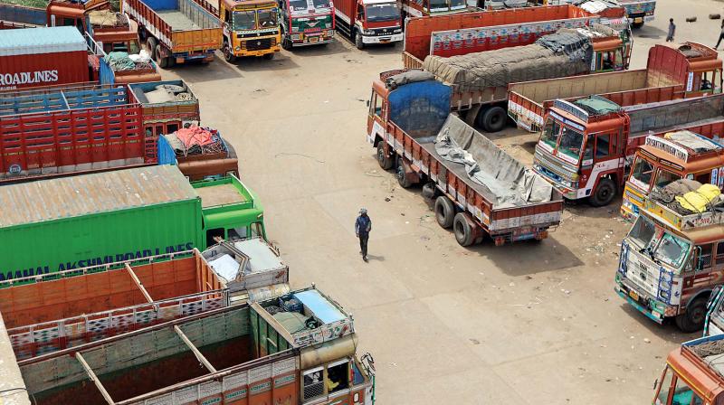 Trucks parked at a truck terminal in Madhavaram following the strike called by transporters on Friday. Their demands include slashing fuel costs, changing the daily revision mechanism, rationalising road toll plazas by announcing one-time toll collection and ending third party insurance premium. (Photo:DC)
