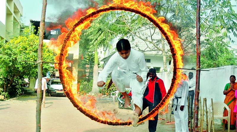 Braveheart: Anjana leaps through a ring of fire.