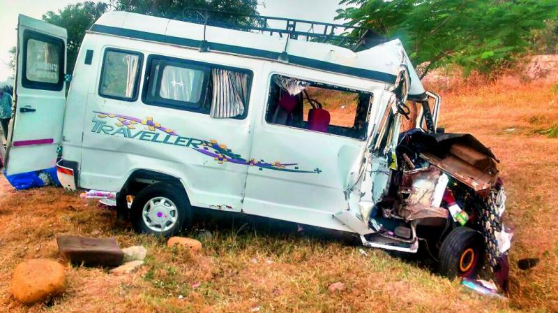 Mangled remains of the van that crashed into a truck at Manoharabad on Sunday. (Photo: DC)