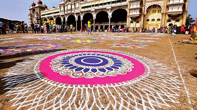 Colourful rangolis drawn at a competition organised as part of Mahila Dasara  in front of the Mysuru Palace on Thursday    Photo: KPN)