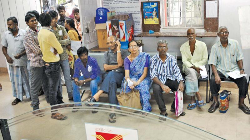 Chennaiites on Sunday visited post offices, to change their old notes. (PhotoL DC)