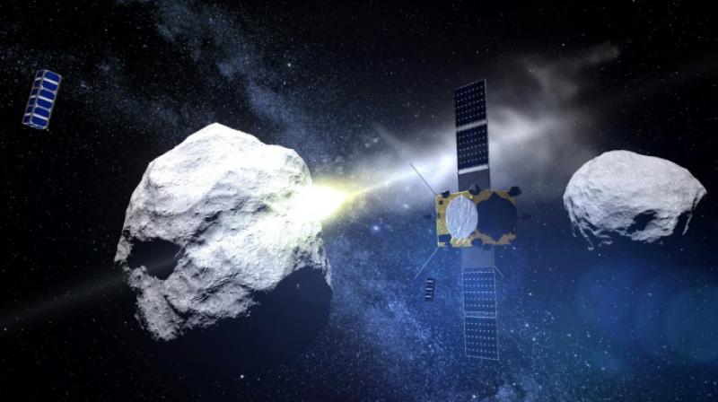 This computer generated handout image released by the European Space Agency (ESA) on May 15, 2015 shows the impact of the DART (Double Asteroid Redirection Test) projectile on the Didymos asteroid. (Photo:AFP)