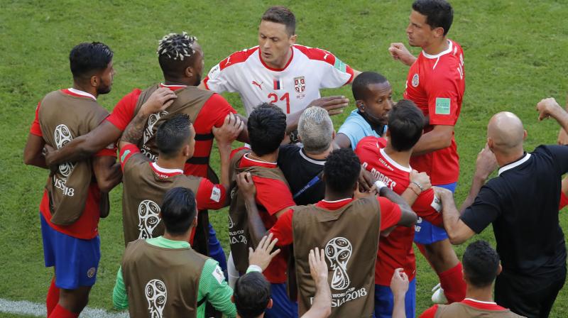 Serbia midfielder Nemanja Matic gets into fight with Costa Rica bench players during their Group E encounter. (Photo: AP)