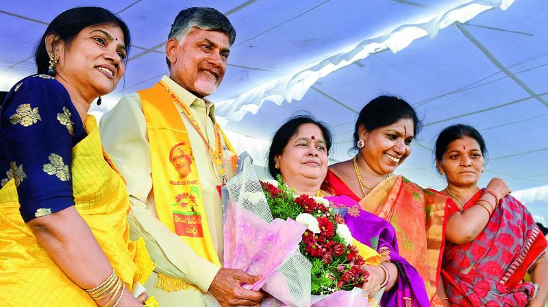 TD president and AP Chief Minister N. Chandrababu Naidu poses with women cadre during a party meeting in Hyderabad on Thursday. (Photo: DC)