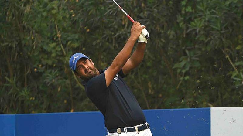 Shiv Kapur in action at the Panasonic Open first round at the Delhi Golf Club on Thursday.