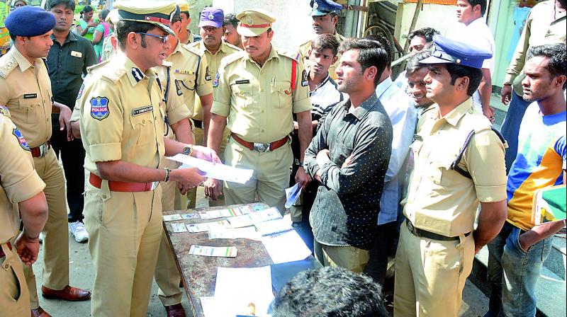 Hyderabad police commissioner V.V. Srinivas Rao collects details during the Sakala Samagra Nerasthula Survey in Kacheguda Crossroads at the Sultan Bazar police limits on Thursday.  (Photo: DC)
