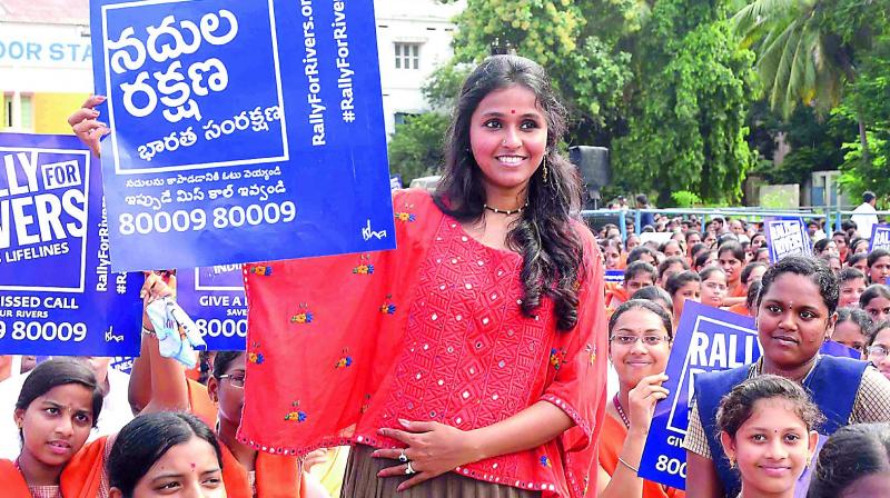 Pop singer Smita and students holding Rally for Rivers placards at a programme in Vijayawada on Wednesday.(Photo: DC)